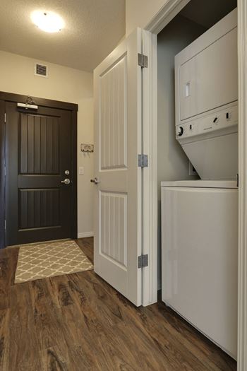 the interior of a home with a laundry room and washer and dryer